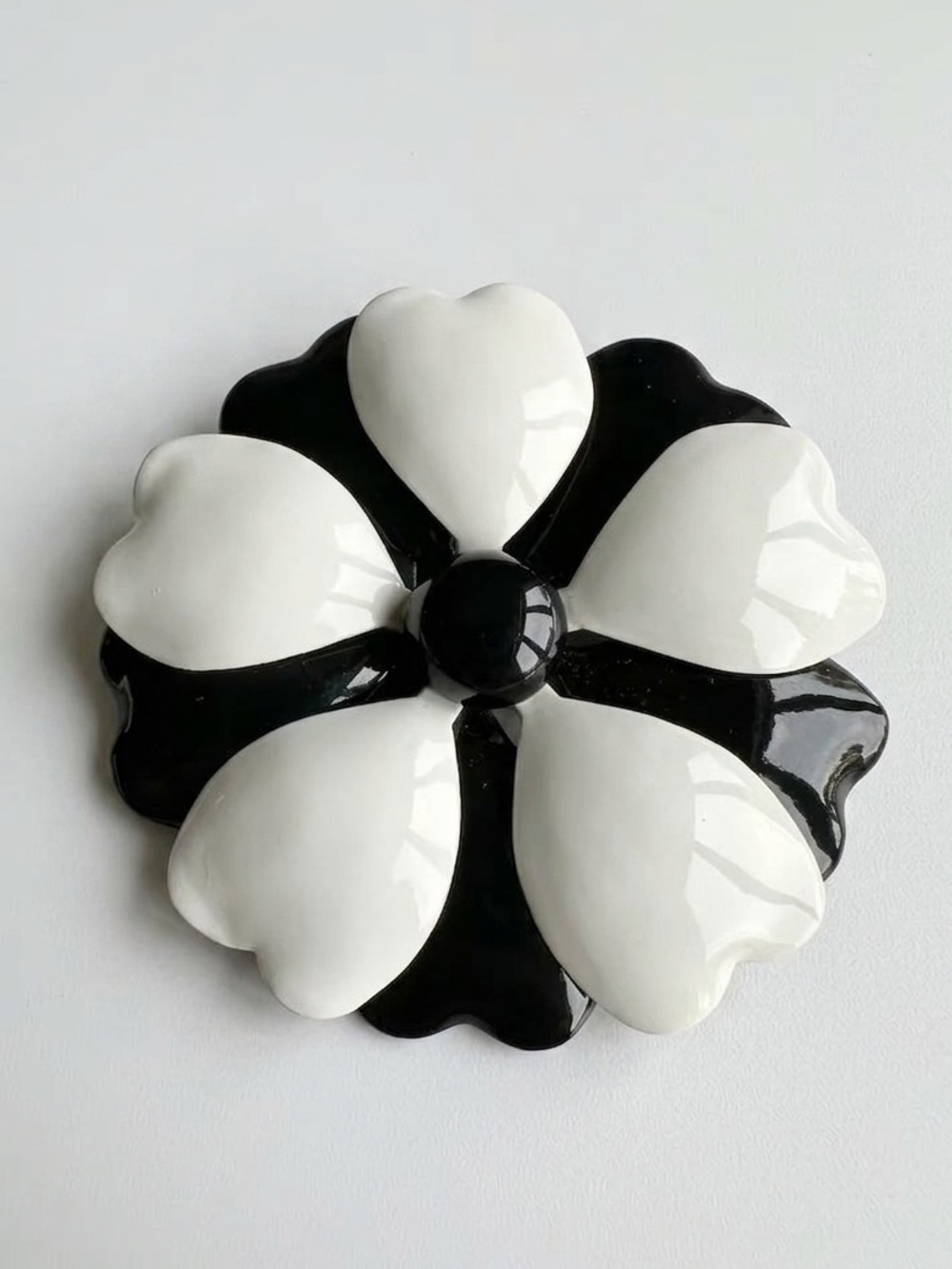 PRISTINE St. John Black and White Enamel Flower Brooch with Heart Petals